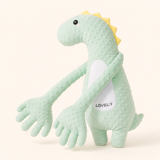 Dino Cocolinoo, peluche dinosaure vert menthe à longues pattes sur fond crème